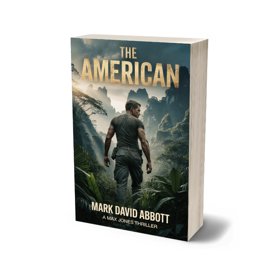 Book titled 'The American' by Mark David Abbott with a jungle scene on the cover.